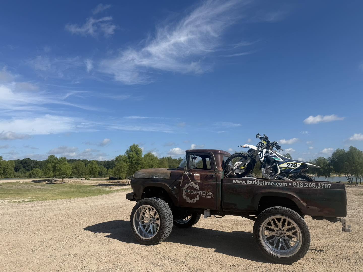 Sovereign Off-Road branded vintage pickup carrying dirt bikes